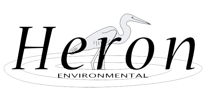 Logo for Heron Environmental of heron bird standing in water behind company name